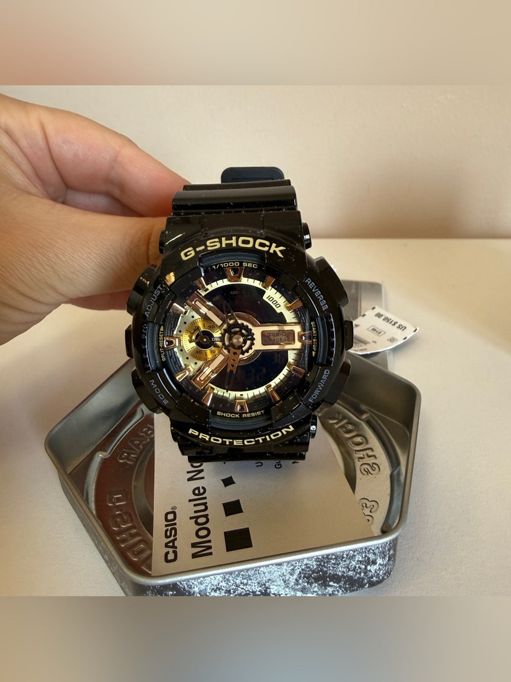 Casio G-SHOCK GA110GB black and gold watch front view