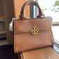 Tory Burch Miller leather satchel in brown with gold hardware front view