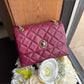 Kate Spade quilted shoulder bag in deep berry front view