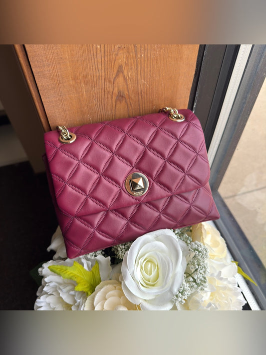 Kate Spade quilted shoulder bag in deep berry front view