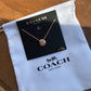 Coach 54514 rose gold disc pendant necklace front view