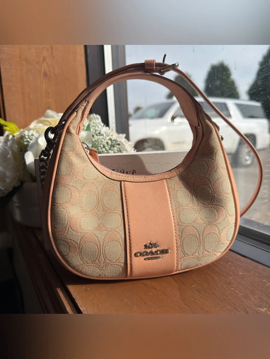 Coach CT773 pink cream signature jacquard crescent bag front view