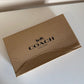 Coach reversible leather belt detail