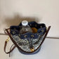 Tory Burch blue and brown mini bucket bag detail