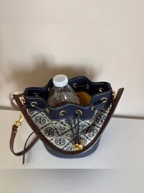 Tory Burch blue and brown mini bucket bag detail