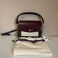 Tory Burch Robinson burgundy black and cream crossbody bag detail