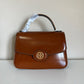 Tory Burch Robinson small brown top handle bag detail