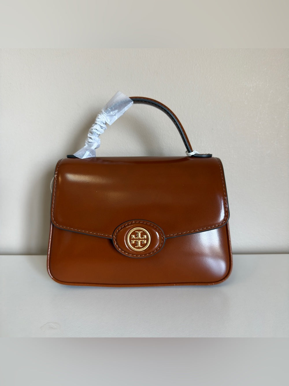 Tory Burch Robinson small brown top handle bag detail