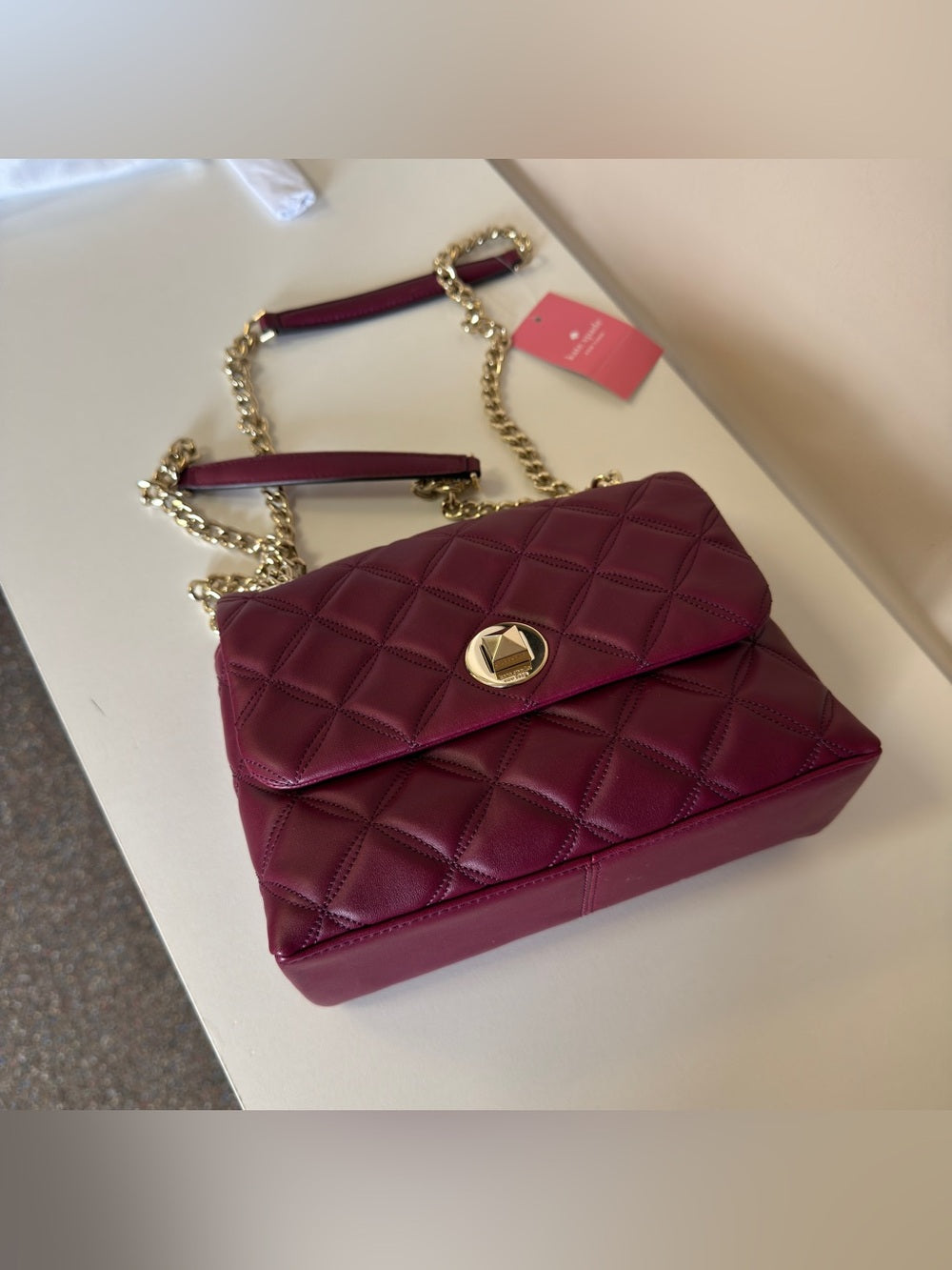 Kate Spade quilted shoulder bag in deep berry detail