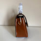 Tory Burch Robinson small brown top handle bag detail