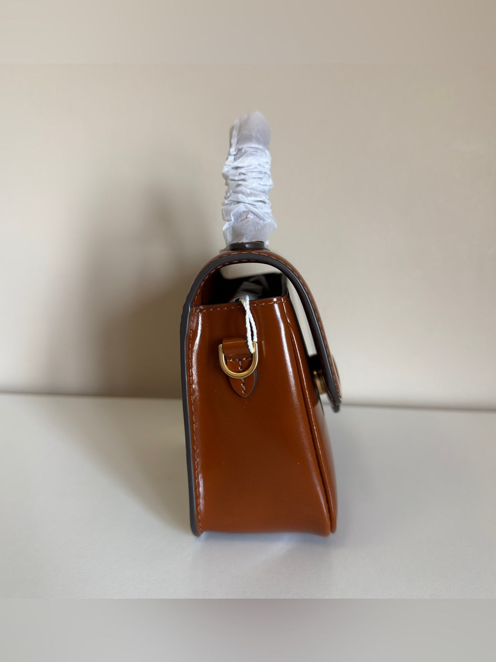 Tory Burch Robinson small brown top handle bag detail