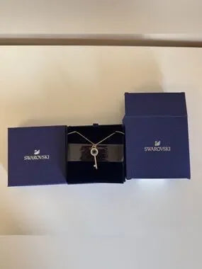 Swarovski rose gold key pendant necklace detail