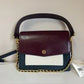 Tory Burch Robinson burgundy black and cream crossbody bag detail