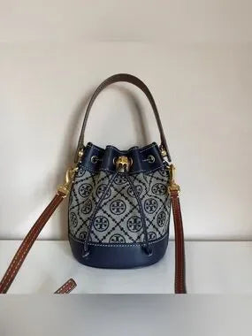 Tory Burch blue and brown mini bucket bag detail