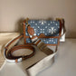 Tory Burch T Monogram denim shoulder bag in blue and brown detail