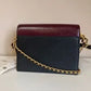 Tory Burch Robinson burgundy black and cream crossbody bag detail