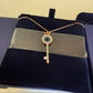 Swarovski rose gold key pendant necklace detail