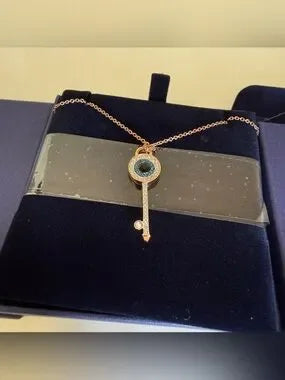 Swarovski rose gold key pendant necklace detail