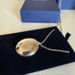 Swarovski green and silver crystal pendant necklace detail