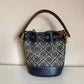 Tory Burch blue and brown mini bucket bag detail
