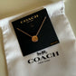 Coach 54514 rose gold disc pendant necklace detail