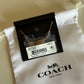 Coach 54514 rose gold disc pendant necklace detail