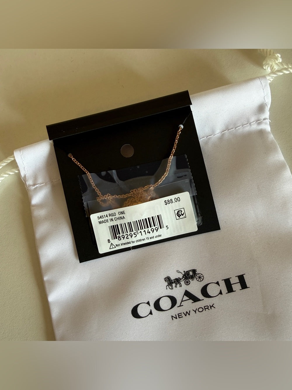 Coach 54514 rose gold disc pendant necklace detail
