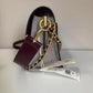 Tory Burch Robinson burgundy black and cream crossbody bag detail