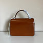 Tory Burch Robinson small brown top handle bag detail