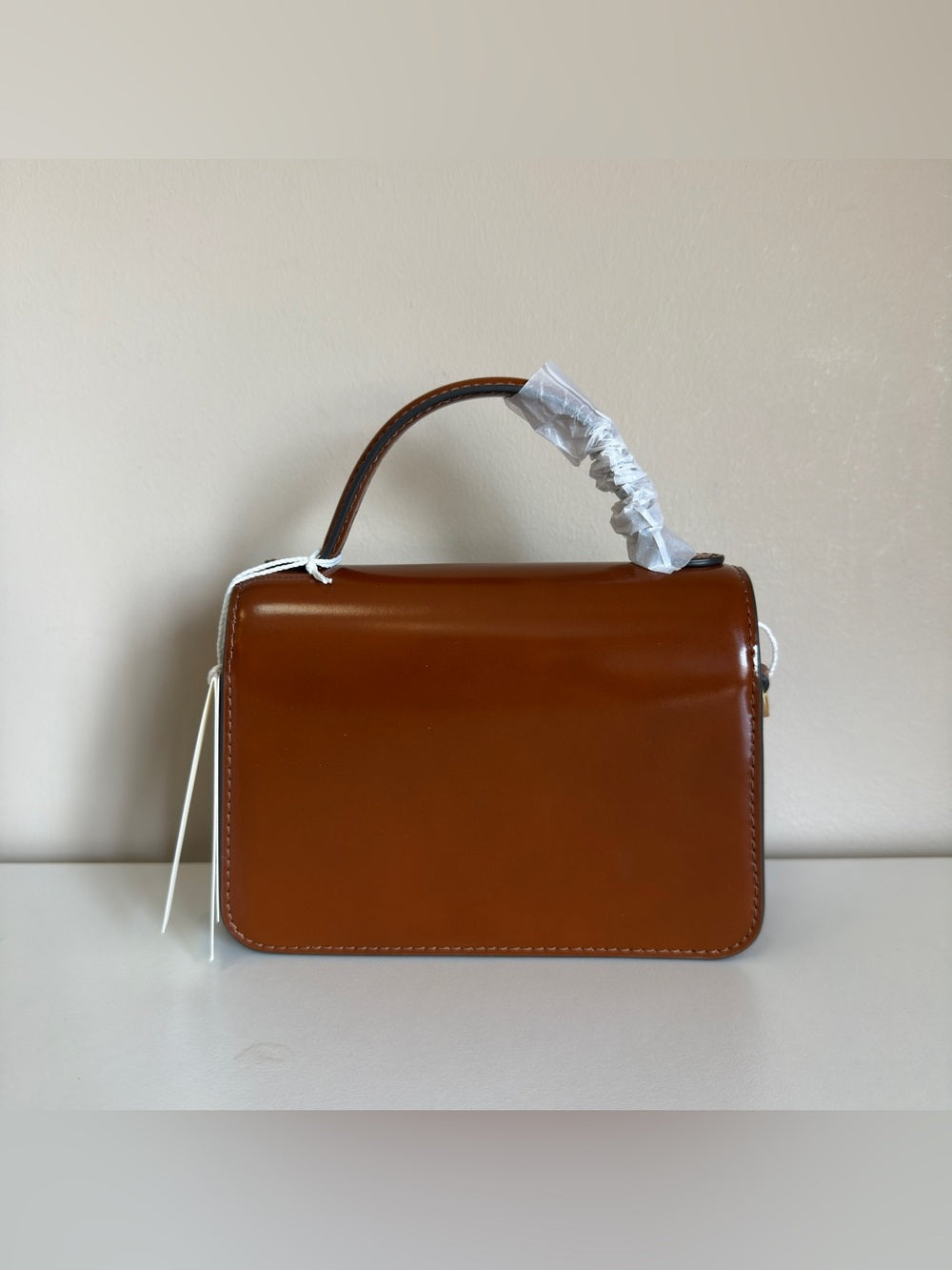 Tory Burch Robinson small brown top handle bag detail