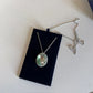Swarovski green and silver crystal pendant necklace detail