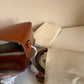 Tory Burch Robinson small brown top handle bag detail
