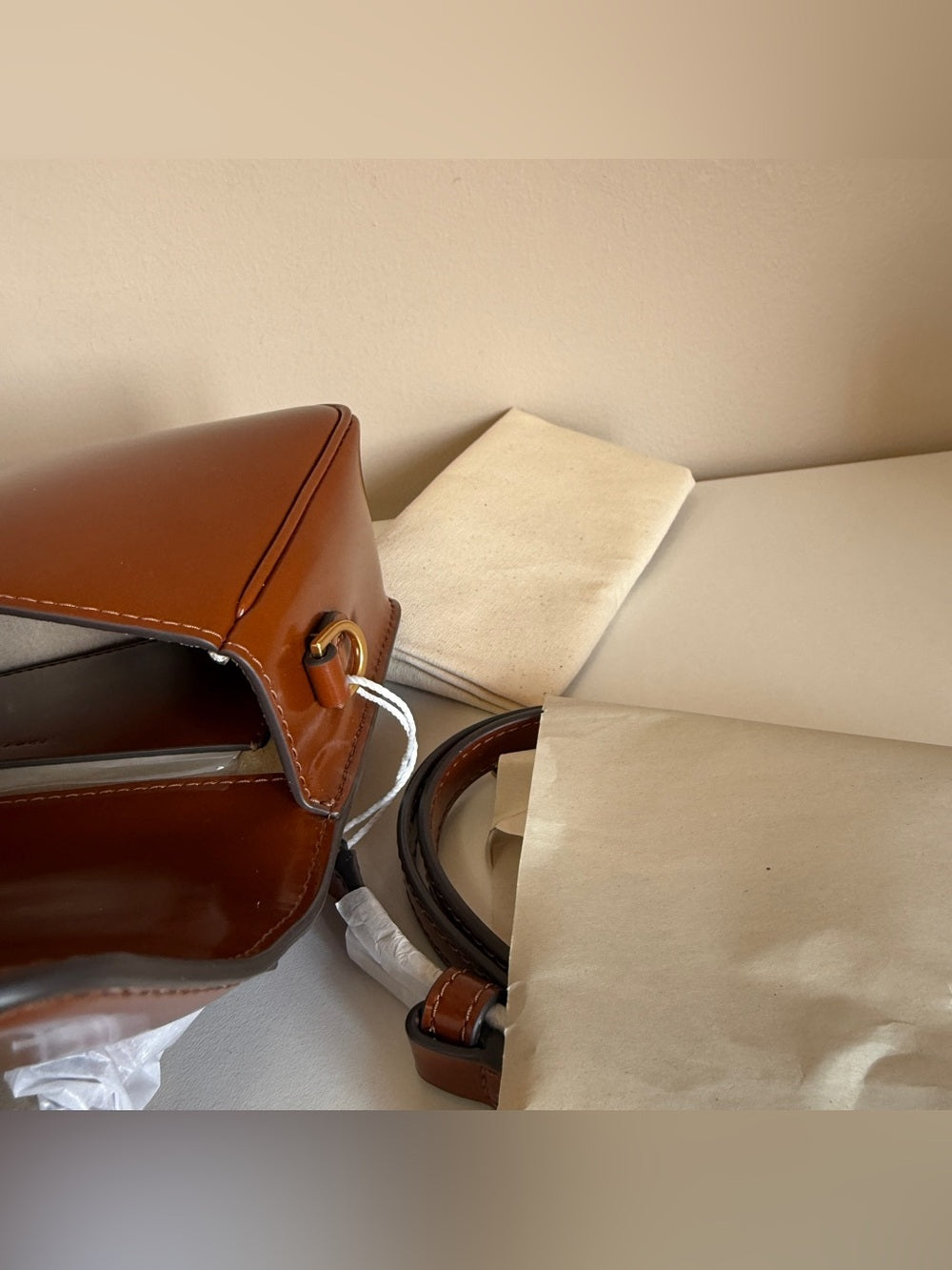 Tory Burch Robinson small brown top handle bag detail