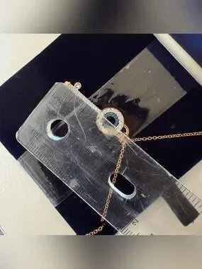 Swarovski rose gold key pendant necklace detail