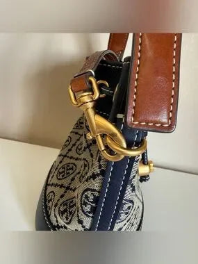 Tory Burch blue and brown mini bucket bag detail