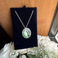 Swarovski green and silver crystal pendant necklace detail