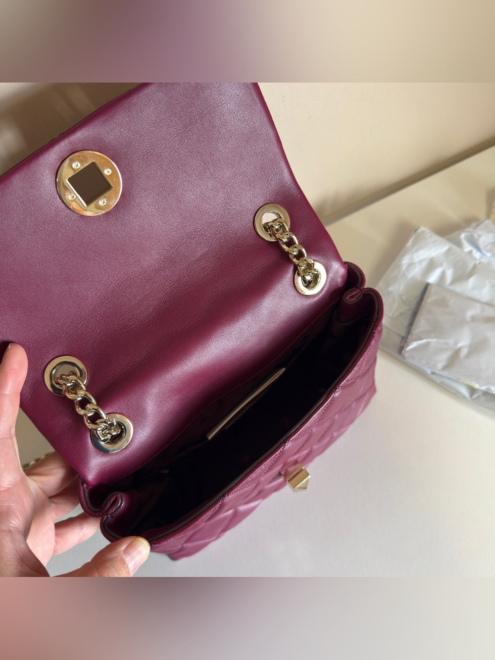 Kate Spade quilted shoulder bag in deep berry detail