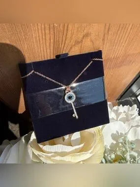 Swarovski rose gold key pendant necklace detail