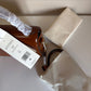 Tory Burch Robinson small brown top handle bag detail