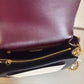 Tory Burch Robinson burgundy black and cream crossbody bag detail