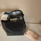 Rebecca Minkoff black leather structured backpack detail