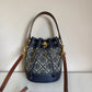 Tory Burch blue and brown mini bucket bag detail