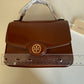 Tory Burch Robinson small brown top handle bag detail