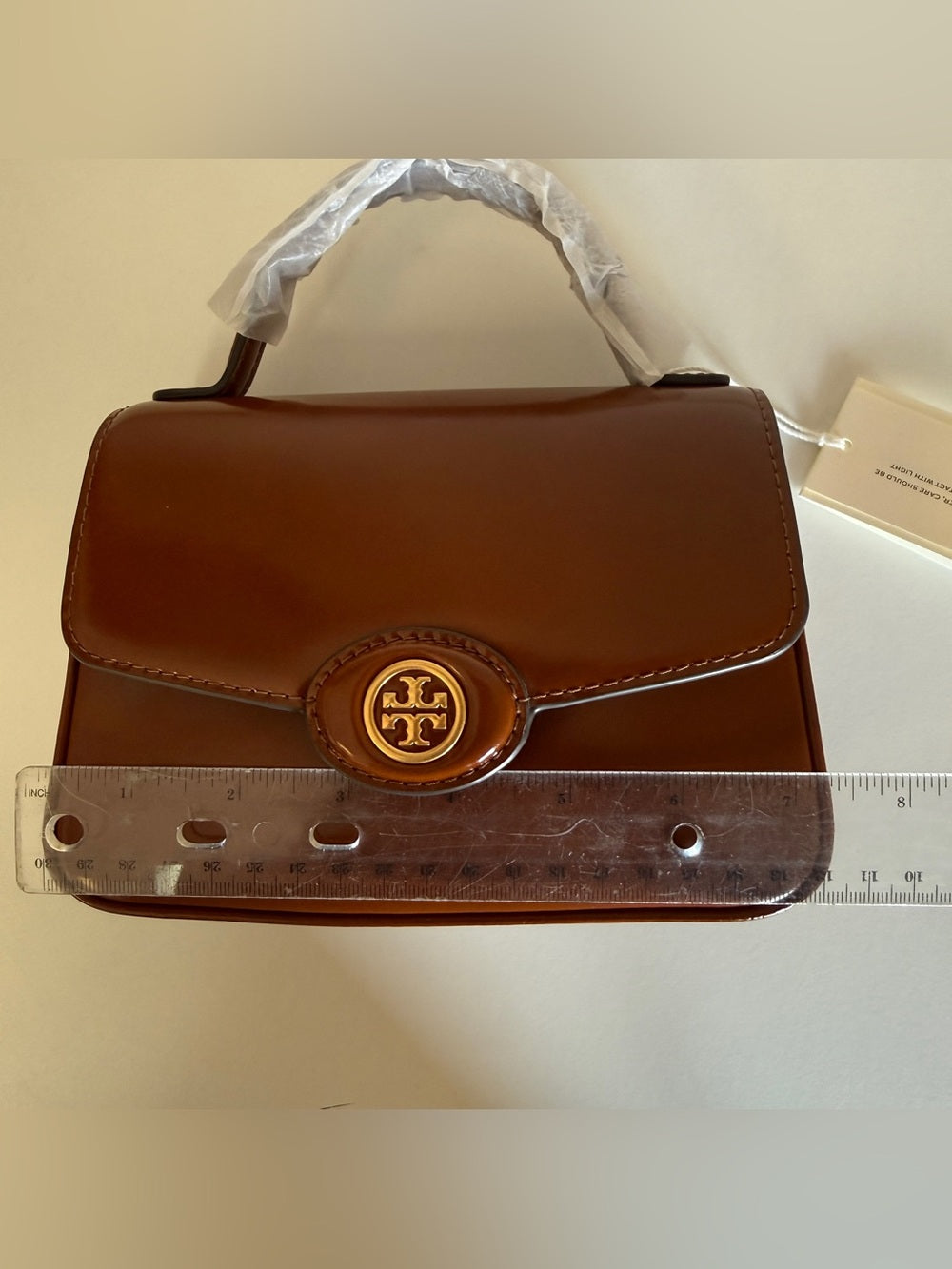 Tory Burch Robinson small brown top handle bag detail