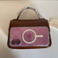 Tory Burch Robinson small brown top handle bag detail