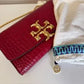 Tory Burch 77037 Eleanor embossed clutch detail