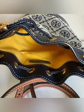 Tory Burch blue and brown mini bucket bag detail
