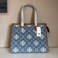Tory Burch T Monogram blue and tan denim small tote detail