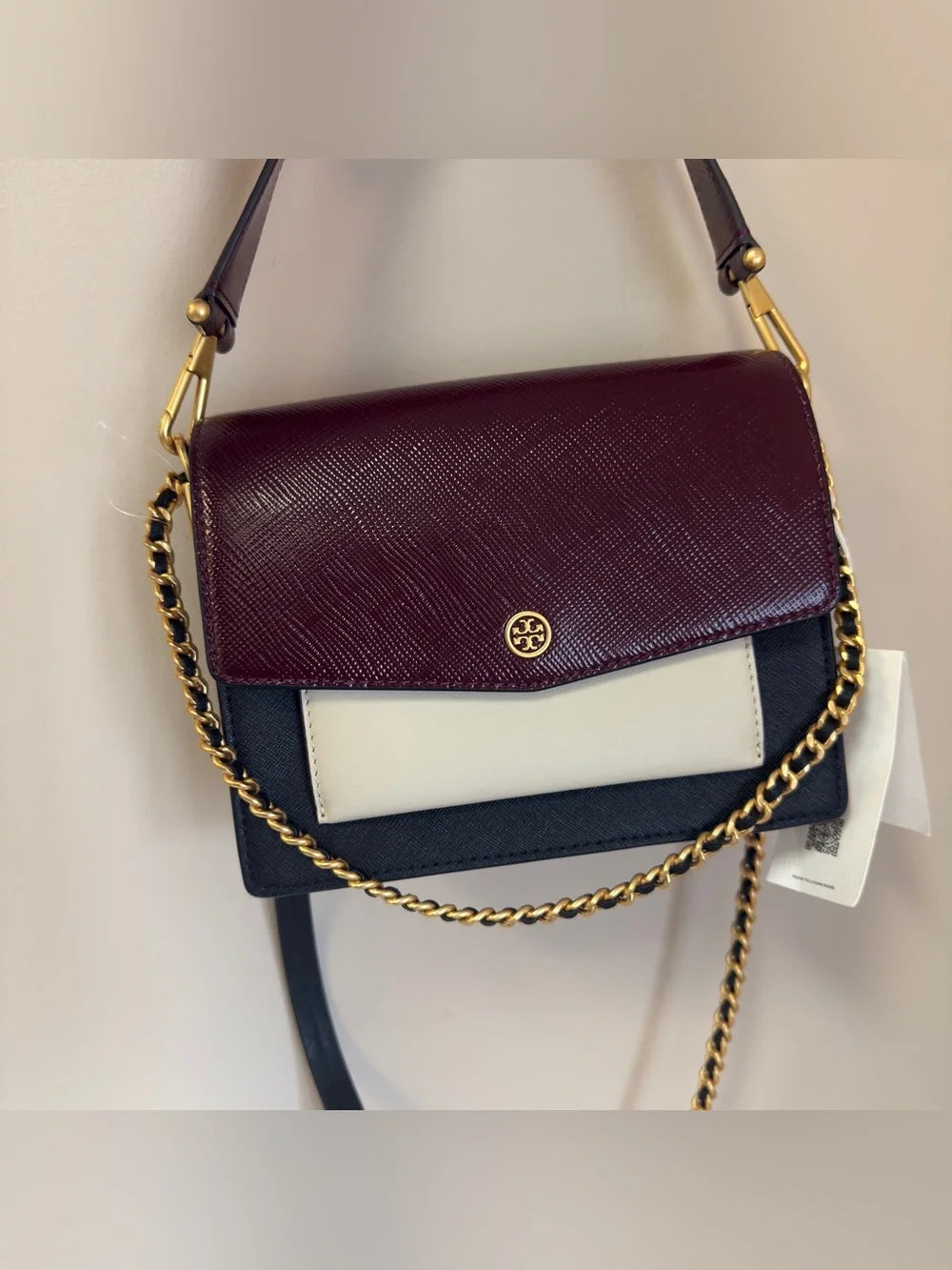 Tory Burch Robinson burgundy black and cream crossbody bag detail
