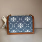 Tory Burch T Monogram denim shoulder bag in blue and brown detail